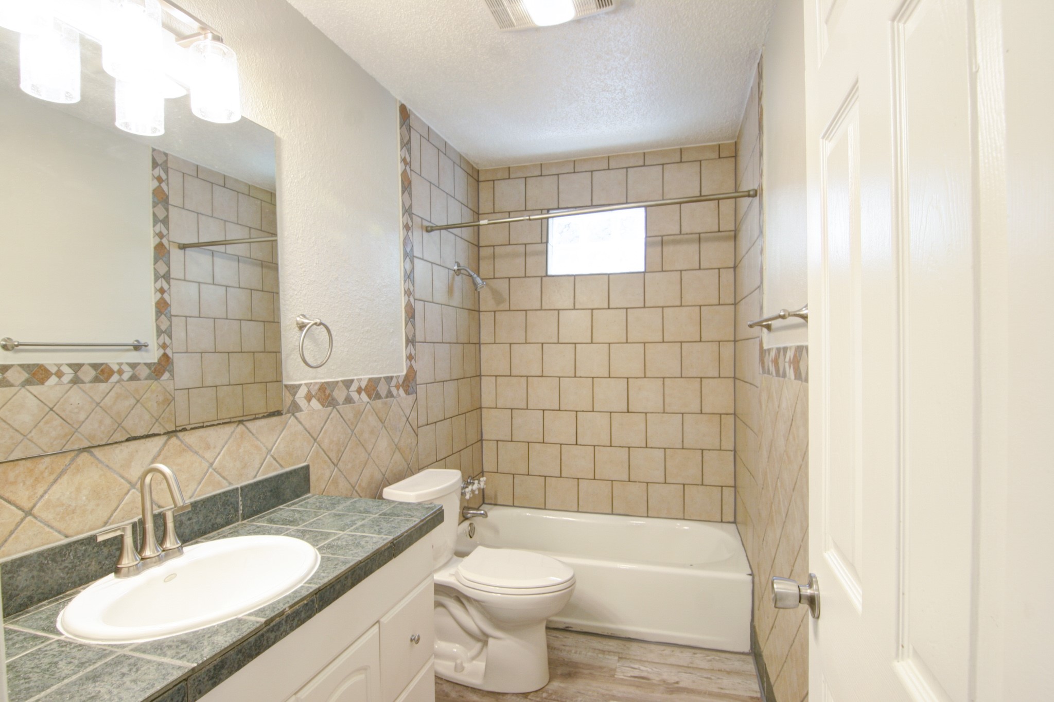 908 Echo Lane Austin, TX 78745 - Photo 12 of 24 a bathroom with a sink a toilet and shower