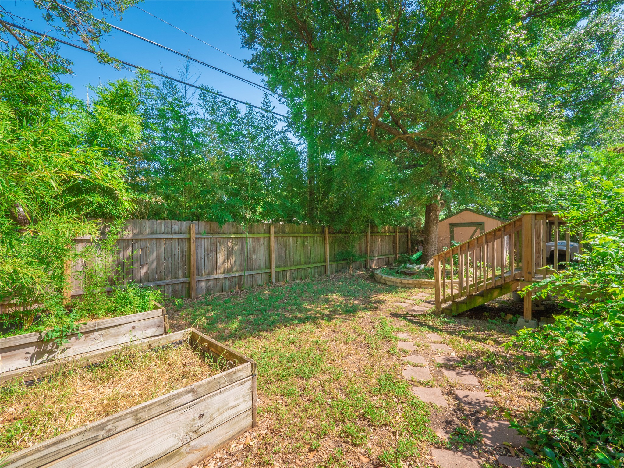 908 Echo Lane Austin, TX 78745 - Photo 20 of 24 a backyard of a house with barbeque oven table and chairs
