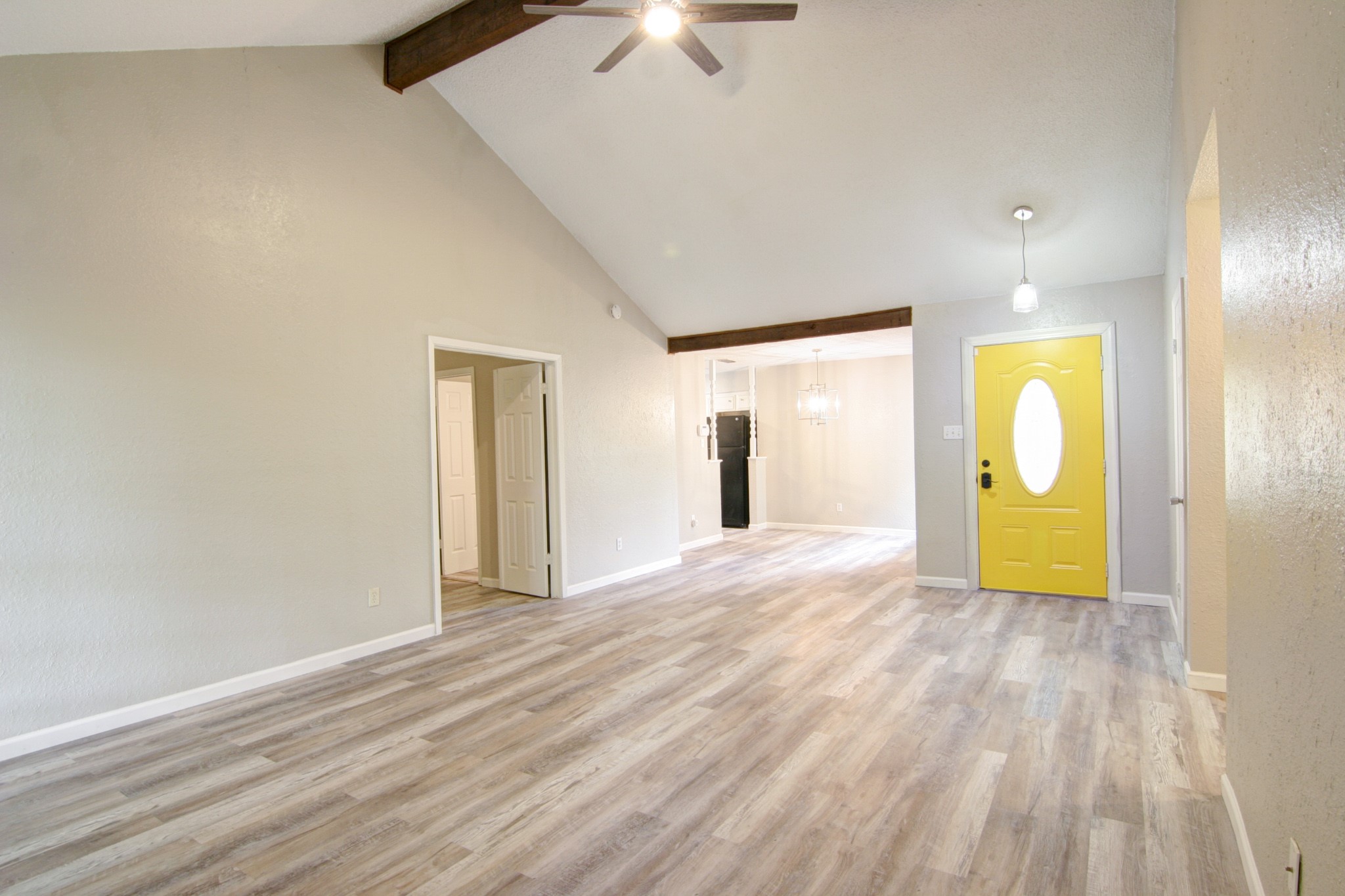 908 Echo Lane Austin, TX 78745 - Photo 5 of 24 a view of a livingroom with wooden floor and a ceiling fan