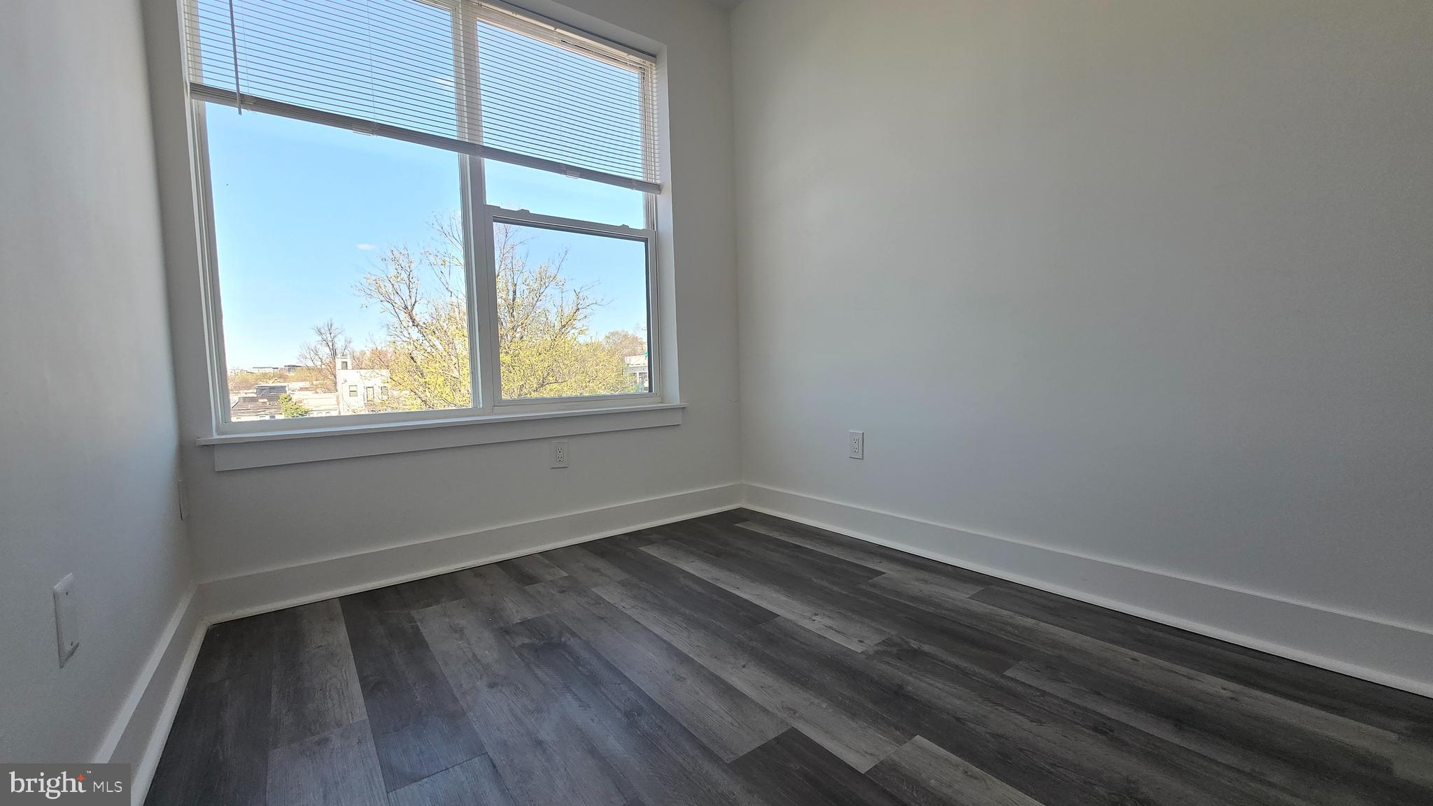 818 Bladensburg Road Northeast, Unit 408 Washington, DC 20002 - Photo 4 of 10 an empty room with a window