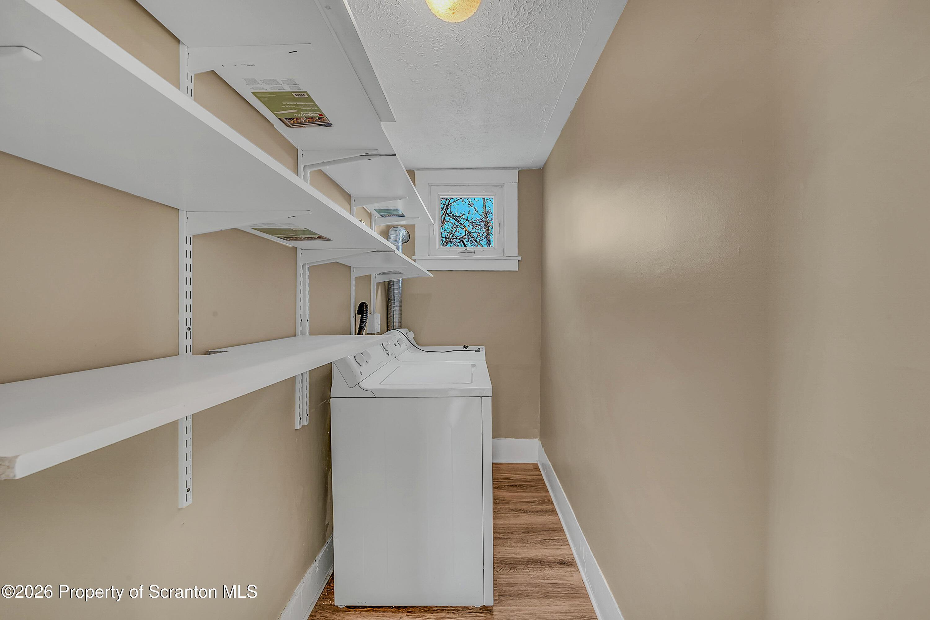 107 2nd Street, Unit 2 Blakely, PA 18447 - Photo 8 of 14 a utility room with dryer and washer