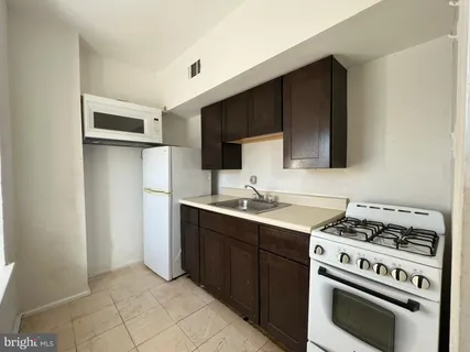 a kitchen with a stove and a microwave