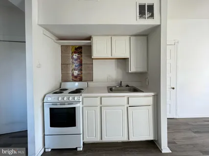 a kitchen with a stove and a microwave