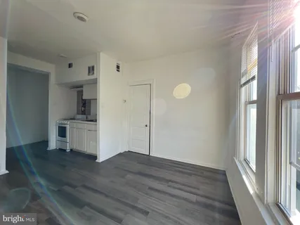 a view of kitchen and wooden floor
