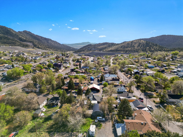 44 Shriver Street Eureka, UT 84628 - Photo 38 of 43 Expansive aerial perspective showcasing a residential area nestled within a mountainous landscape under a clear sky