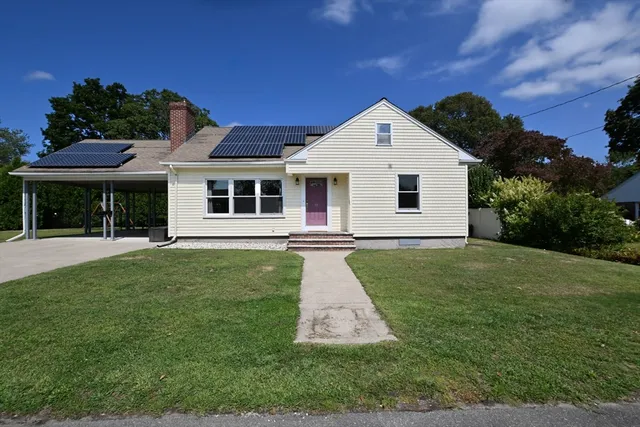 a front view of a house with a yard