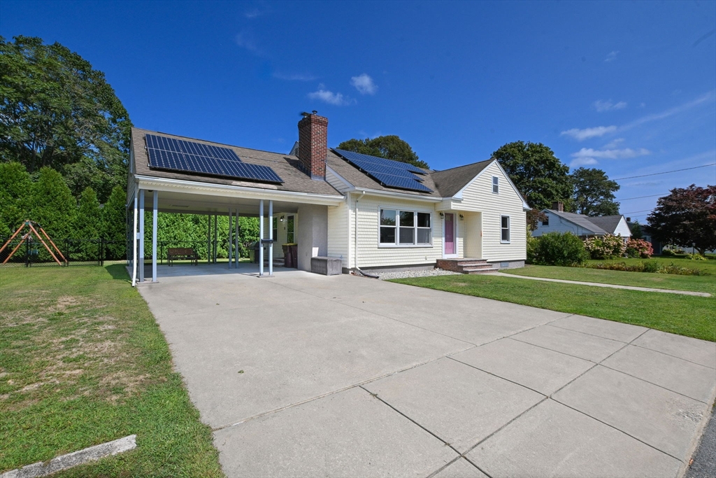 33 Harbeck Street Acushnet, MA 02743 - Photo 23 of 34 a view of house with yard outdoor seating and green space