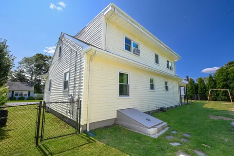 an aerial view of houses with outdoor space
