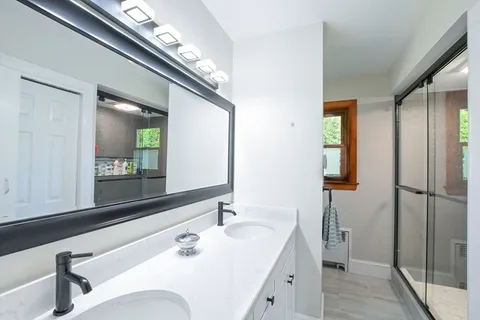 a bedroom with furniture and wooden floor