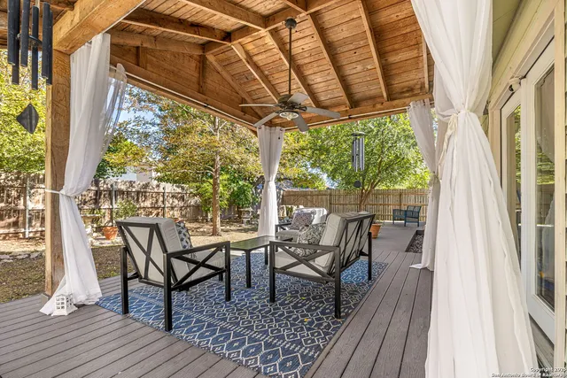 a view of living room with furniture and wooden floor