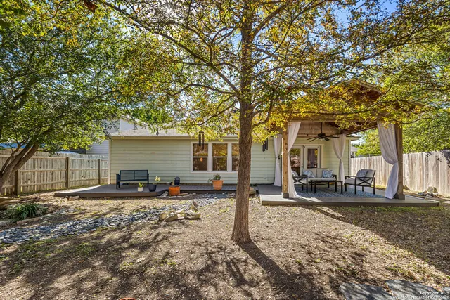 a backyard of a house with seating space