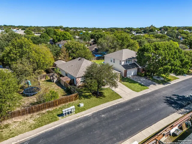 an aerial view of a house with a garden