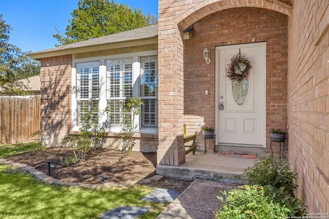 a backyard of a house with outdoor seating