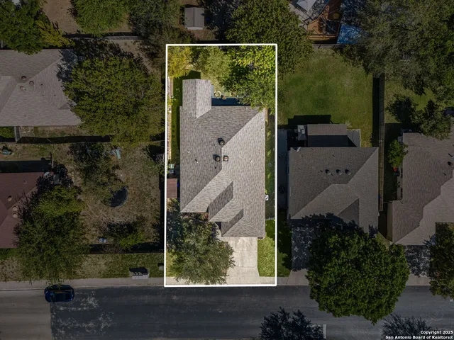 an aerial view of a house having yard