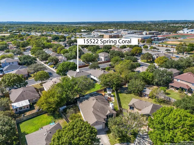 an aerial view of residential houses with outdoor space