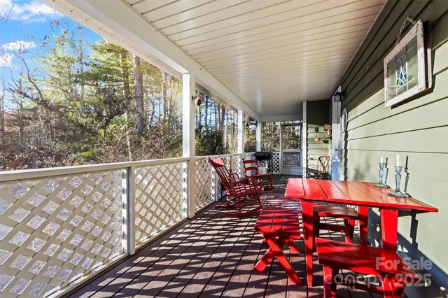 a balcony with furniture and wooden floor