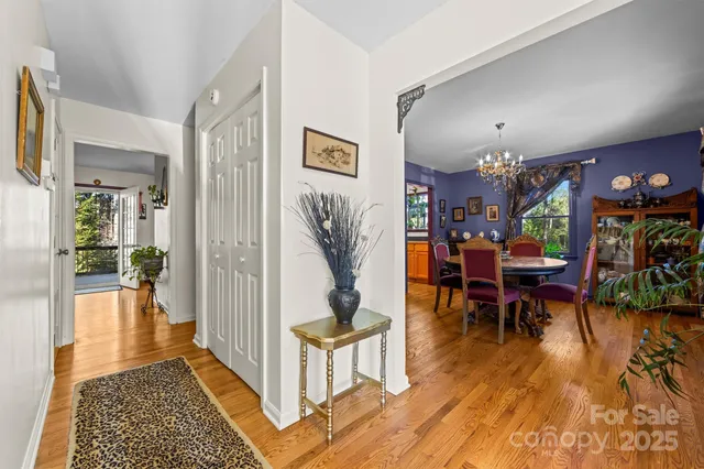 a view of a dining room with furniture wooden floor and a rug