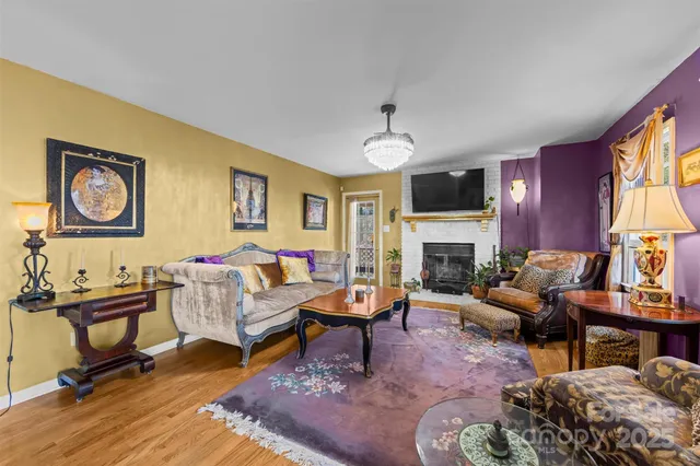 a living room with furniture fireplace and window