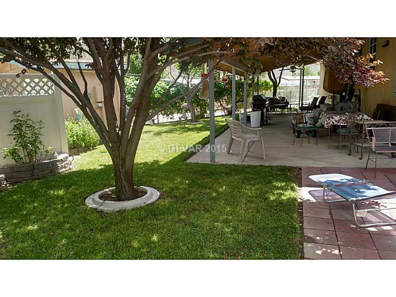 943 Holt Caliente, NV 89008 - Photo 9 of 35 Property Photo. Backyard - Lush Landscaping