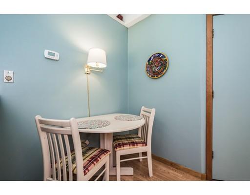 9 Sutcliffe Road Holland, MA 01521 - Photo 18 of 42 a view of a dining room that has a table and a chair