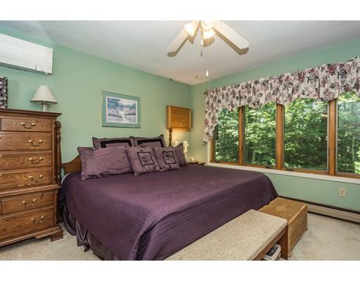 9 Sutcliffe Road Holland, MA 01521 - Photo 20 of 42 a bed room with a bed window and a chandelier