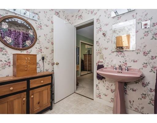 9 Sutcliffe Road Holland, MA 01521 - Photo 22 of 42 a bathroom with a sink mirror and vanity