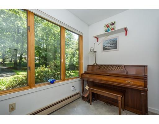 9 Sutcliffe Road Holland, MA 01521 - Photo 25 of 42 a sitting area with wooden floor and a window