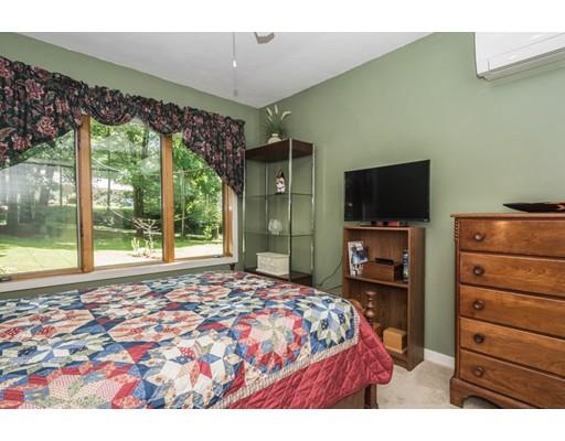 9 Sutcliffe Road Holland, MA 01521 - Photo 27 of 42 a bedroom with a bed and a television