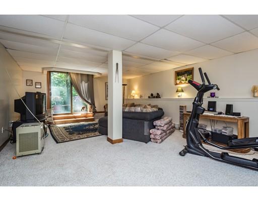 9 Sutcliffe Road Holland, MA 01521 - Photo 28 of 42 a room with gym equipment and large mirror