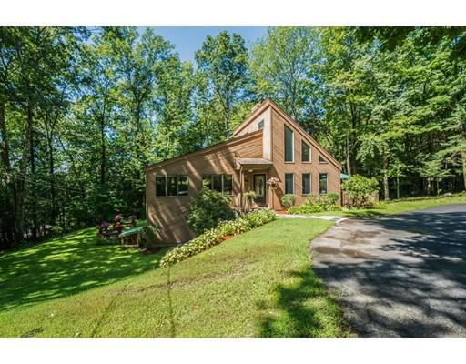 9 Sutcliffe Road Holland, MA 01521 - Photo 41 of 42 a house with green field in front of it