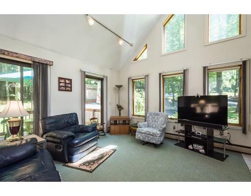 9 Sutcliffe Road Holland, MA 01521 - Photo 7 of 42 a living room with furniture and a flat screen tv