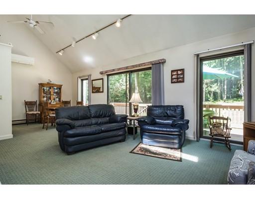 9 Sutcliffe Road Holland, MA 01521 - Photo 10 of 42 a living room with furniture and a floor to ceiling window