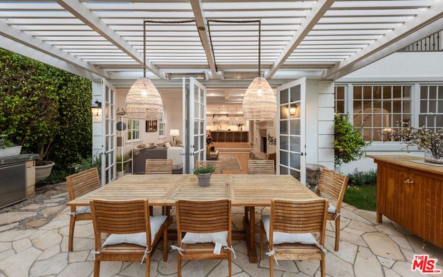 a dining space with furniture and outdoor view