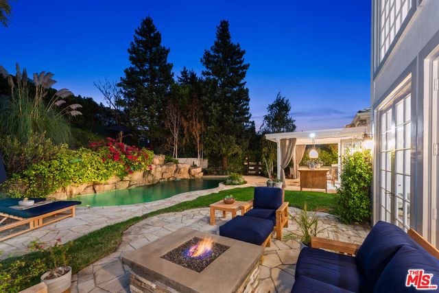 a view of yard from deck having patio