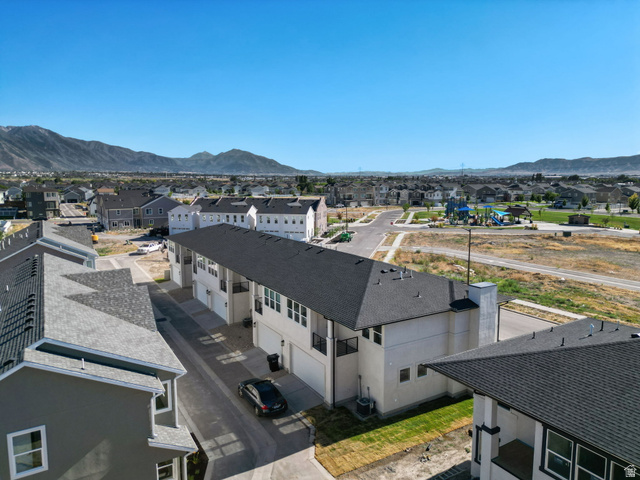 717 South Harrison Drive West Springville, UT 84663 - Photo 29 of 31 Townhome community with asphalt shingle roofs and integrated garages