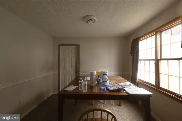 a view of a livingroom with furniture and windows
