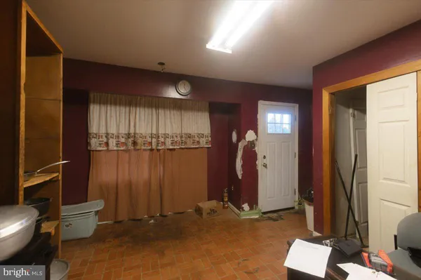 a kitchen with a stove and a refrigerator