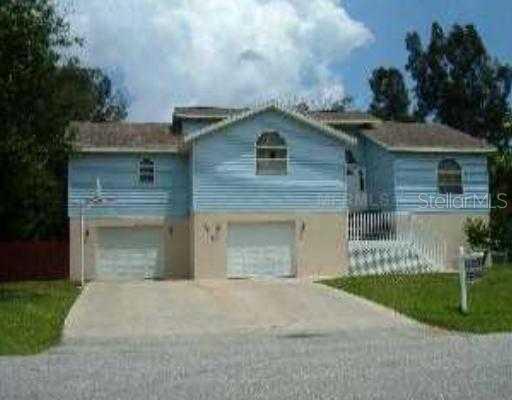 3131 Fallow Road Venice, FL 34293 - Photo 1 of 1 a front view of a house with a garden and plants