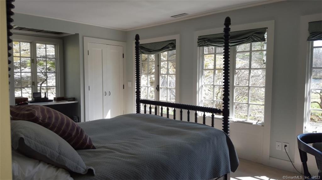 261 Taconic Road Salisbury, CT 06068 - Photo 11 of 20 a bedroom with a large bed and a window