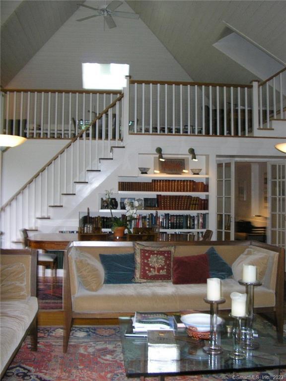 261 Taconic Road Salisbury, CT 06068 - Photo 6 of 20 a view of a living room and kitchen with furniture wooden floor and window