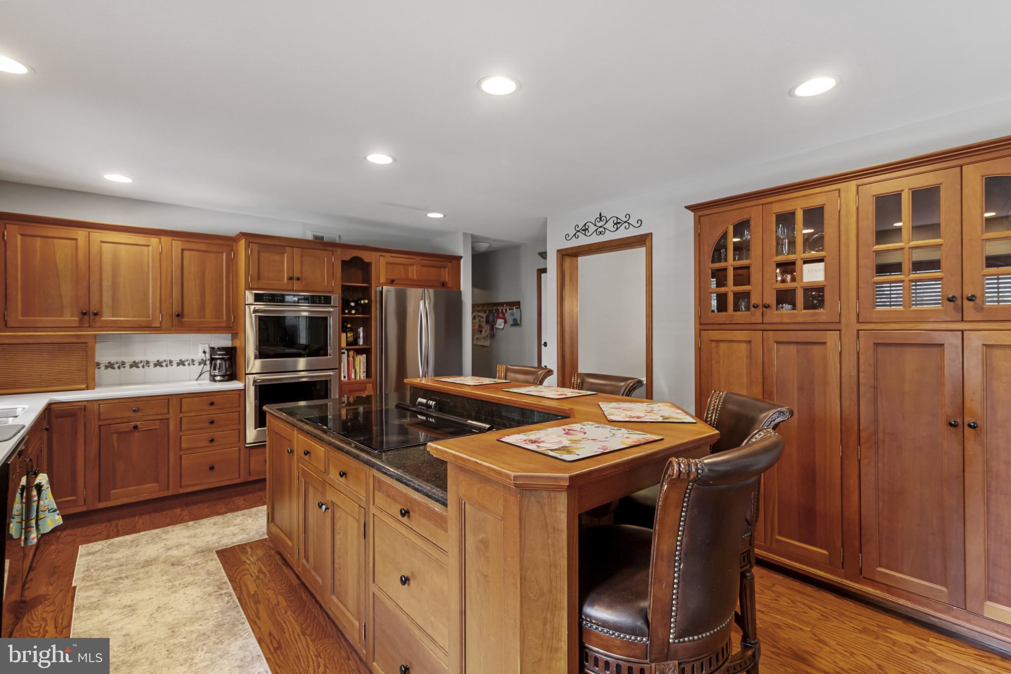 62 John Dyer Way Doylestown, PA 18902 - Photo 14 of 37 a kitchen that has a lot of cabinets in it and wooden floors