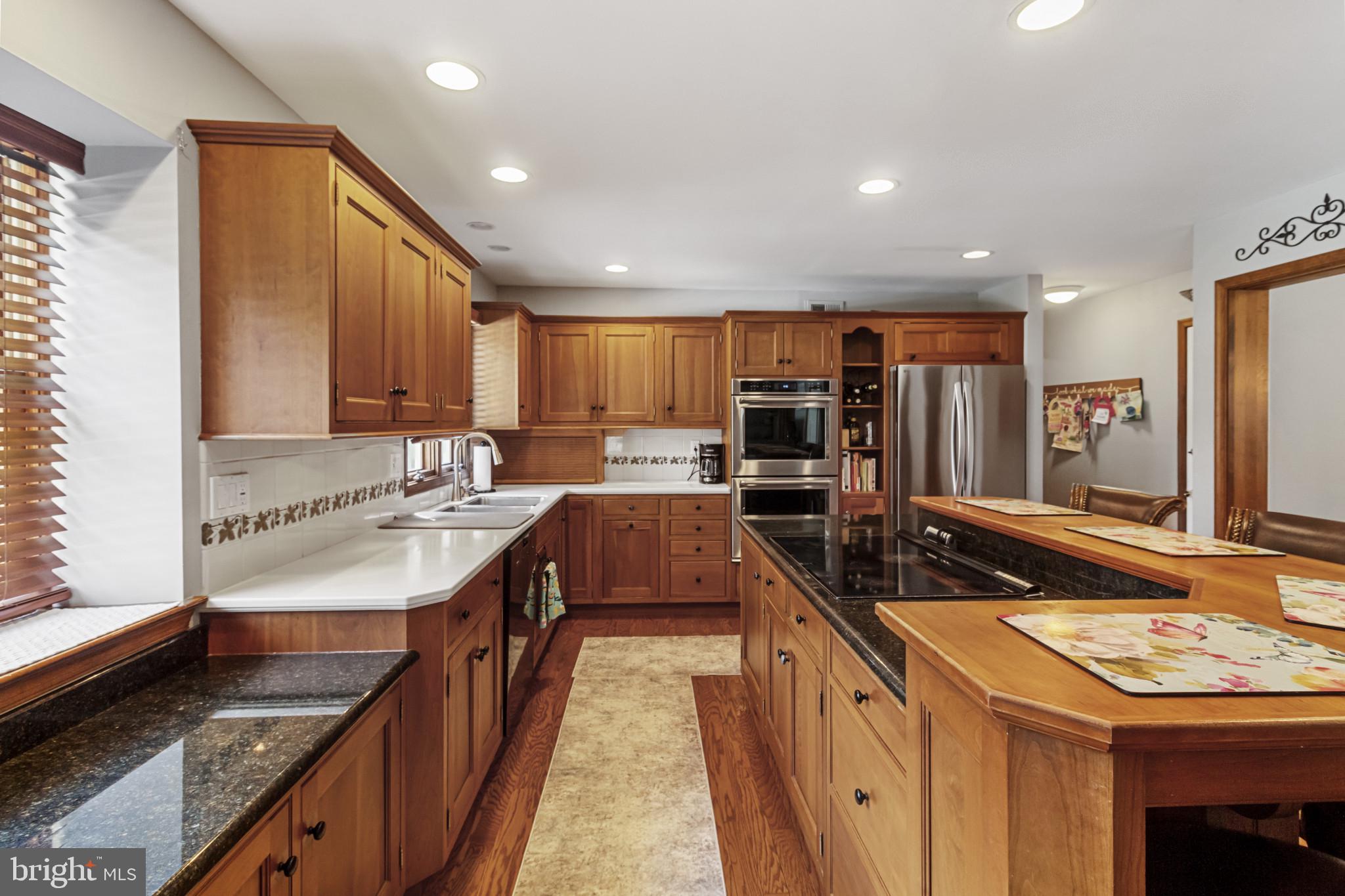 62 John Dyer Way Doylestown, PA 18902 - Photo 15 of 37 a large kitchen with kitchen island granite countertop a sink and cabinets