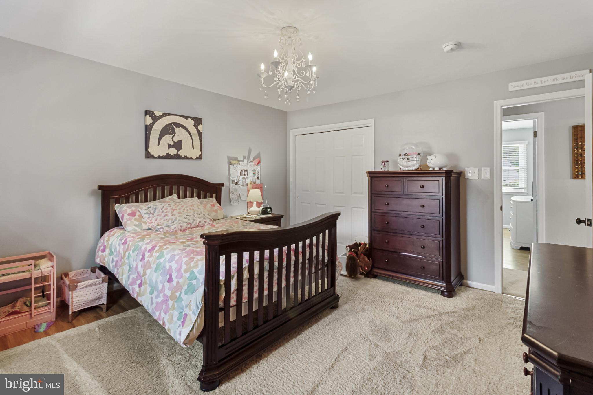 62 John Dyer Way Doylestown, PA 18902 - Photo 25 of 37 a bedroom with a bed and a chandelier