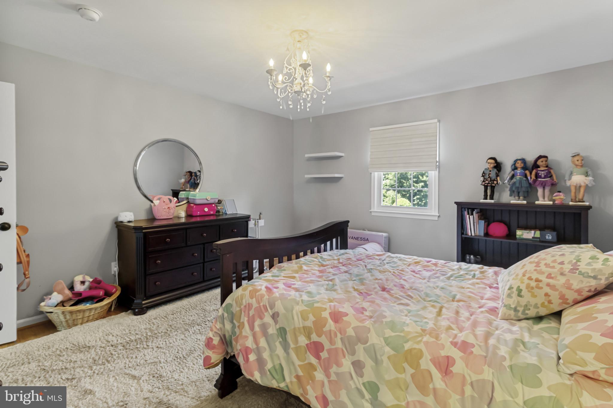 62 John Dyer Way Doylestown, PA 18902 - Photo 26 of 37 a bedroom with a bed and a chandelier