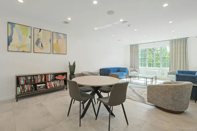 a dining room with furniture and window