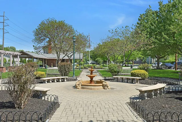 a sitting area with furniture in front of the house