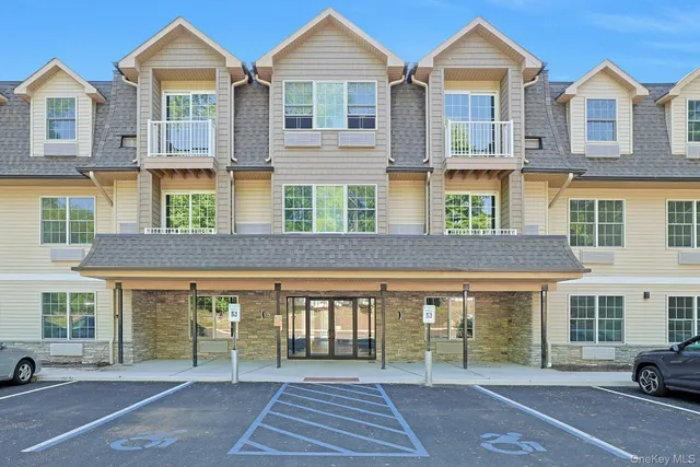 a front view of a building with windows