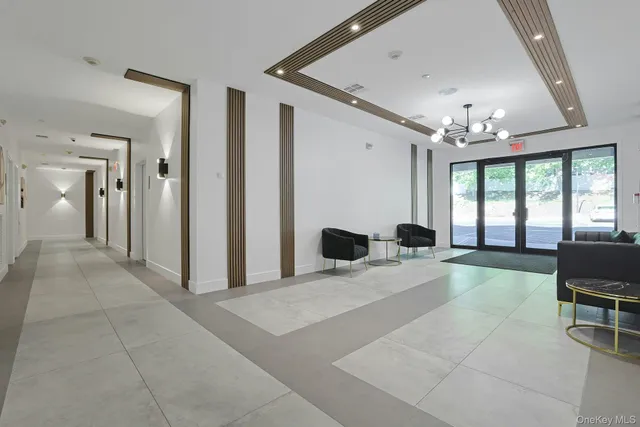 a large bedroom with a large bed and tv