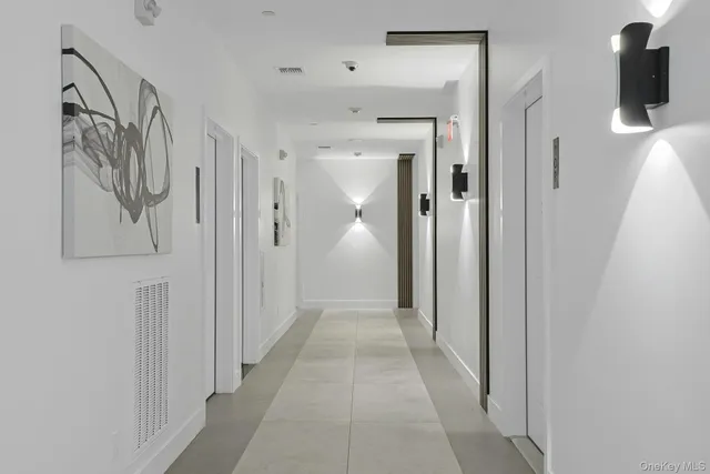 a view of a hallway with walk in closet