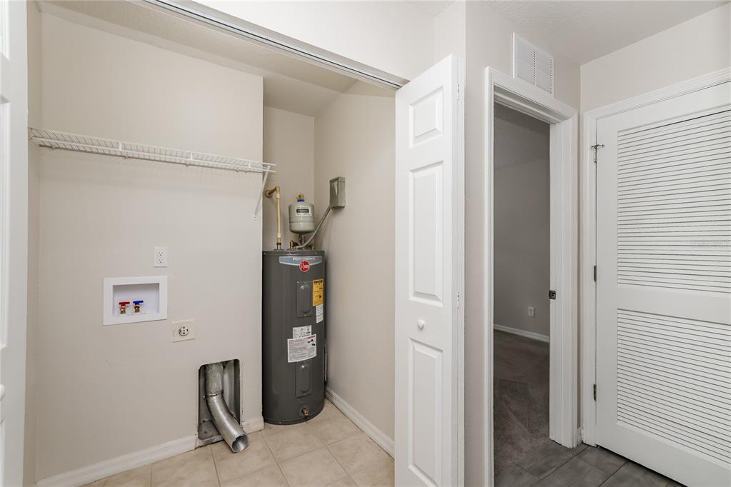 146 Hidden Lk Loop Haines City, FL 33844 - Photo 14 of 16 a room with storage and utility